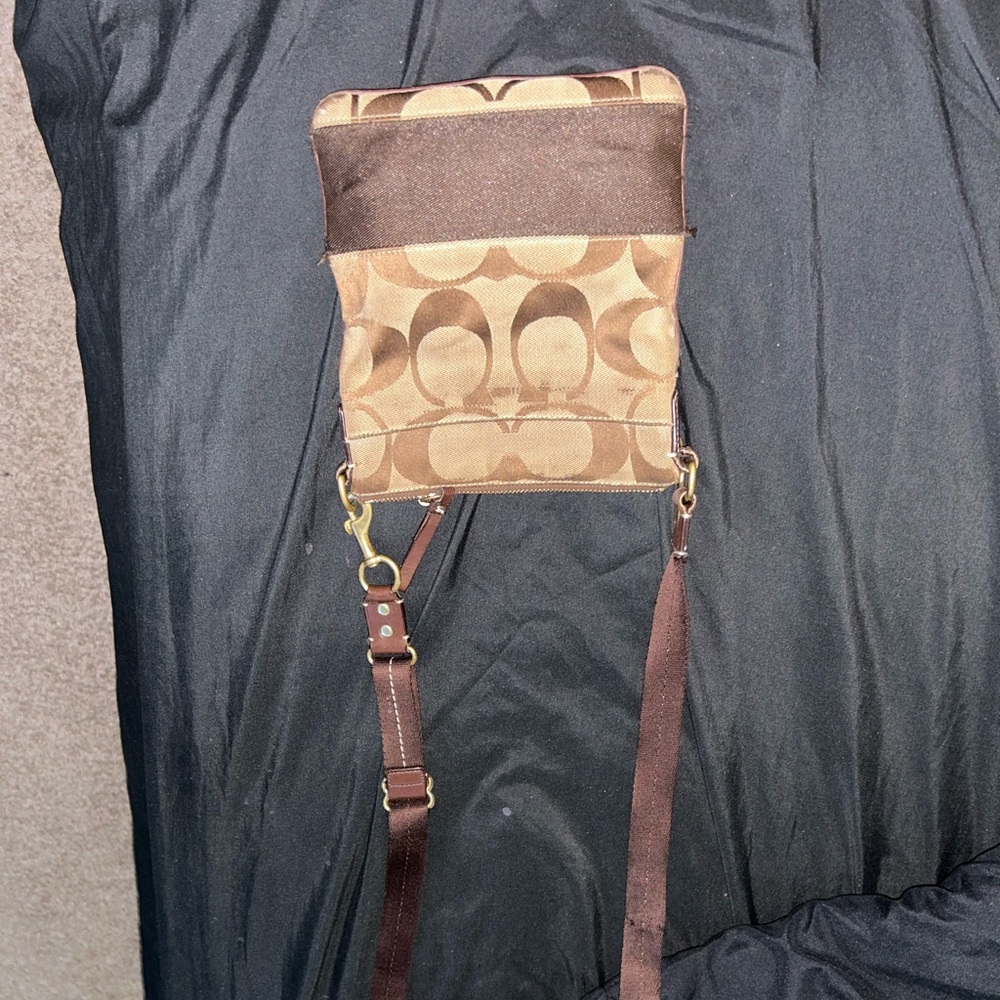 Very used simple crossbody with a few stains